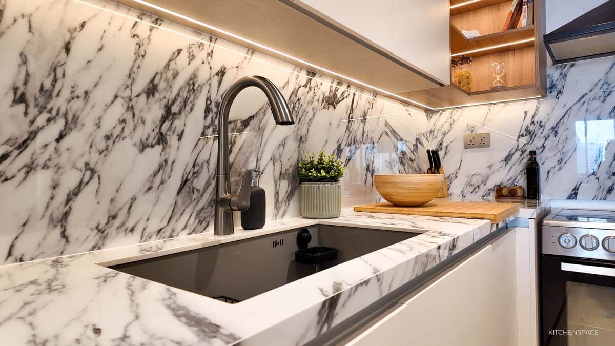 Open-Concept Marble Waterfall Kitchen